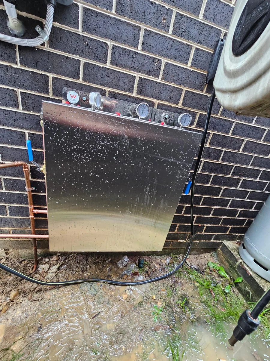 Stainless steel housing cover fitted over a whole house filtration system